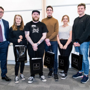 Winners of the CALA Homes Student Partnership Award appear in a property PR photo