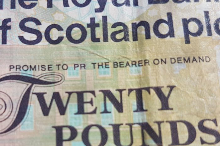 PR message on bank note to illustrate PR costs and charges