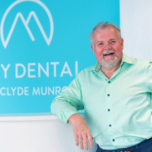 Health PR photography shot of Jim Hall with Clyde Munro logo, Clyde Munro Dental Group, CEO and Founder, Jim Hall and Jacqui Frederick